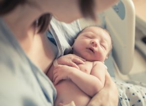 New,Born,Baby,Boy,Resting,In,Mothers,Arms.